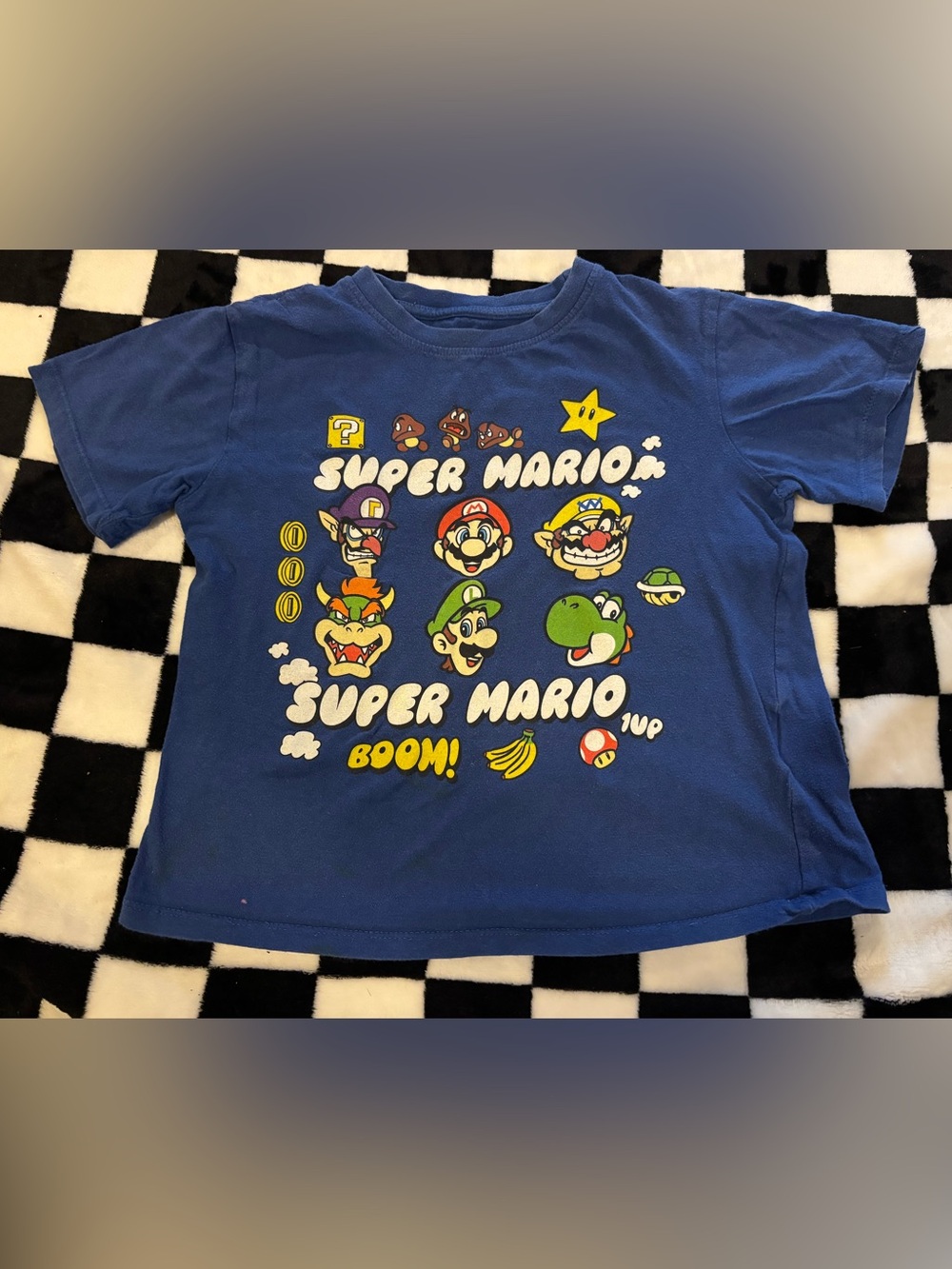 Boys size 6 Mario shirt (small dot stain)